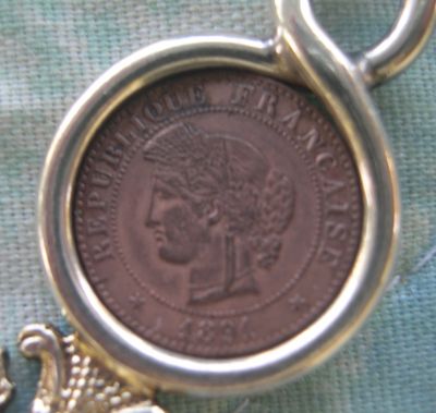 france 1 centime coin spoon
